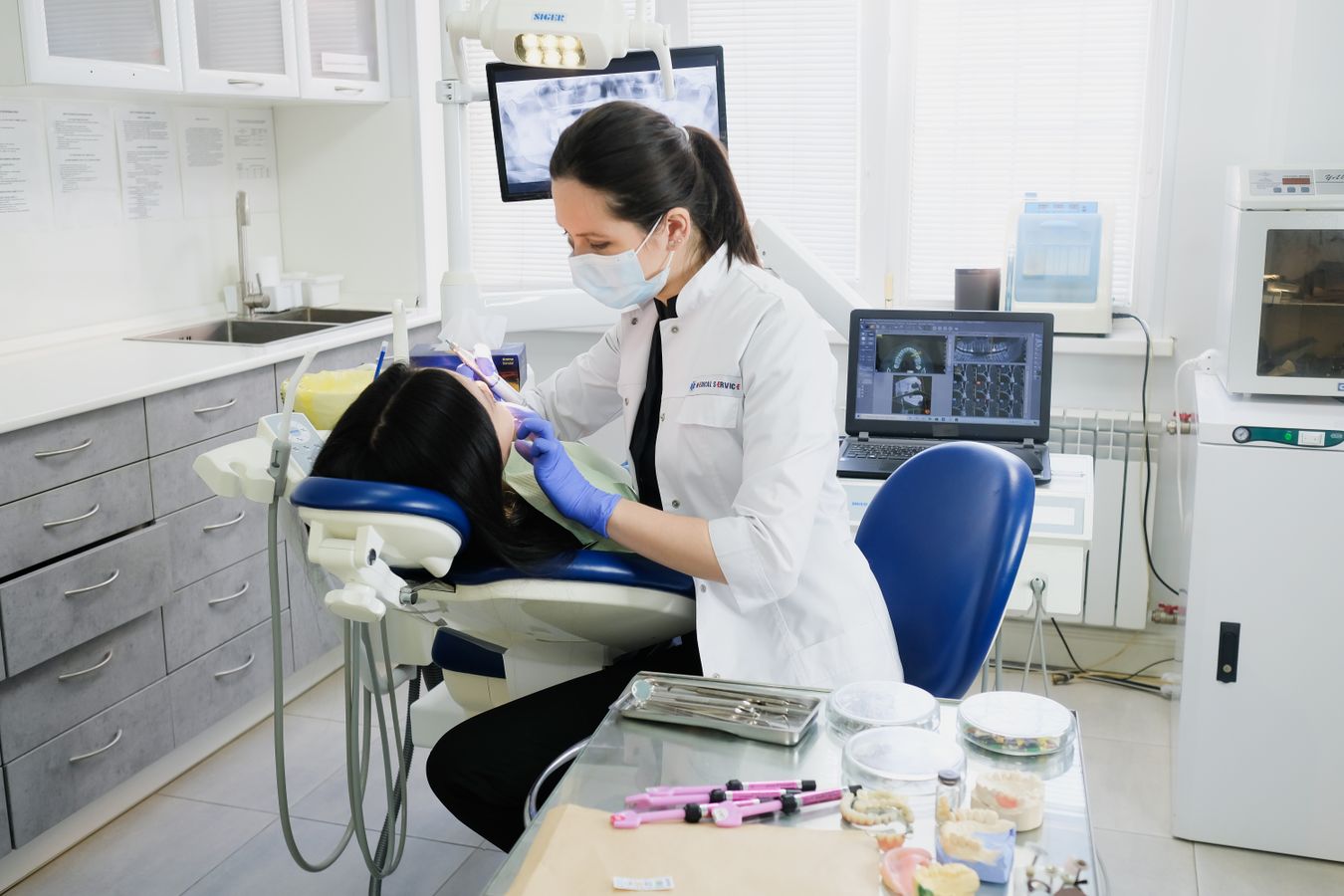 A dentist carrying out a routine examination in a modern dental surgery